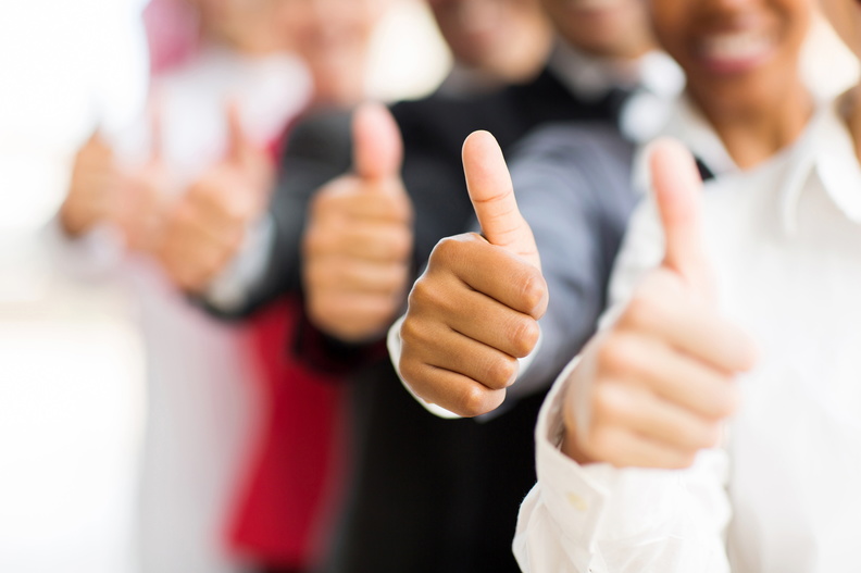 business people giving thumbs up